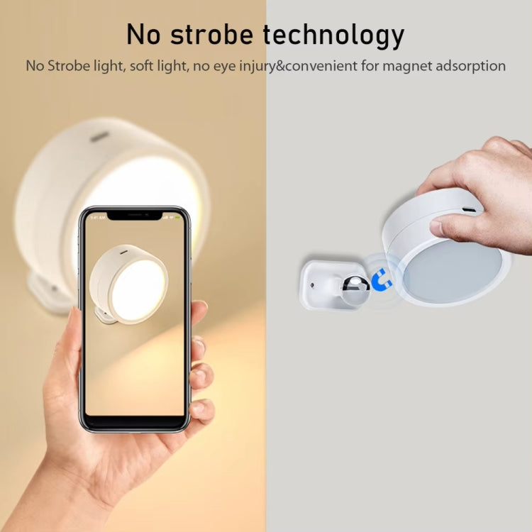 White rotating LED magnetic spotlight being attached, with soft glowing ring