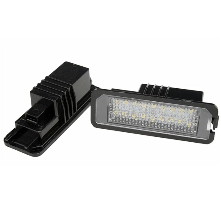 LED license plate light with ribbed black mount and clear white LED lens
