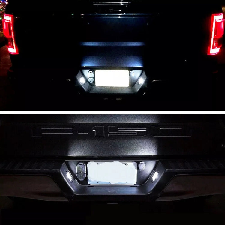 Glowing LED license plate lights on rear pickup license plate area