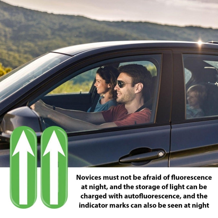 Glowing green up-arrow stickers placed on car window interior, visible at night
