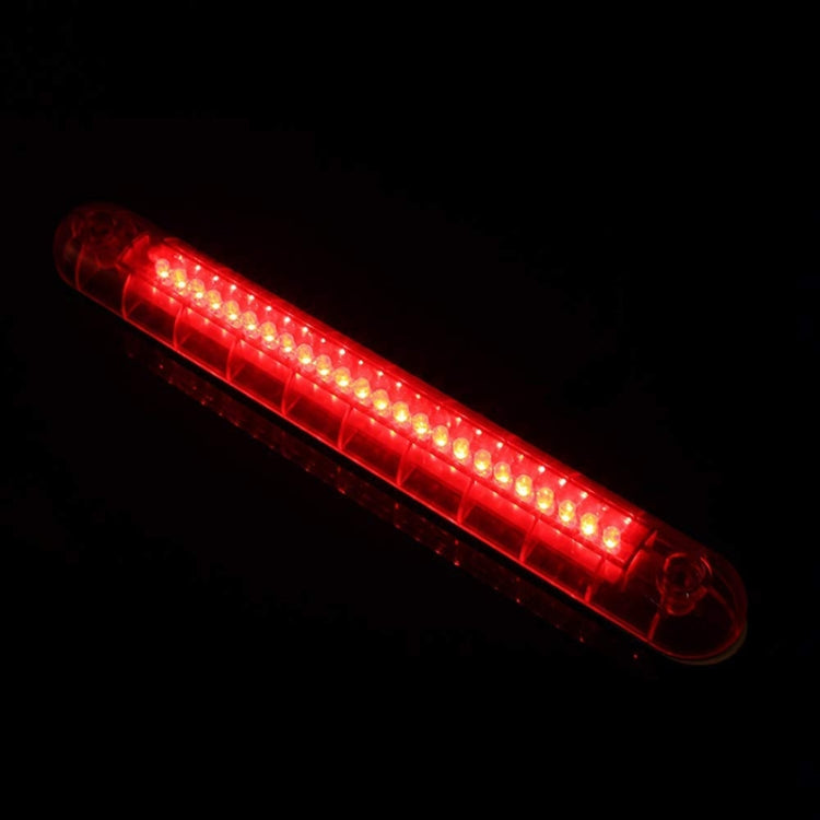 Glowing red LED brake light strip in a high-mounted housing
