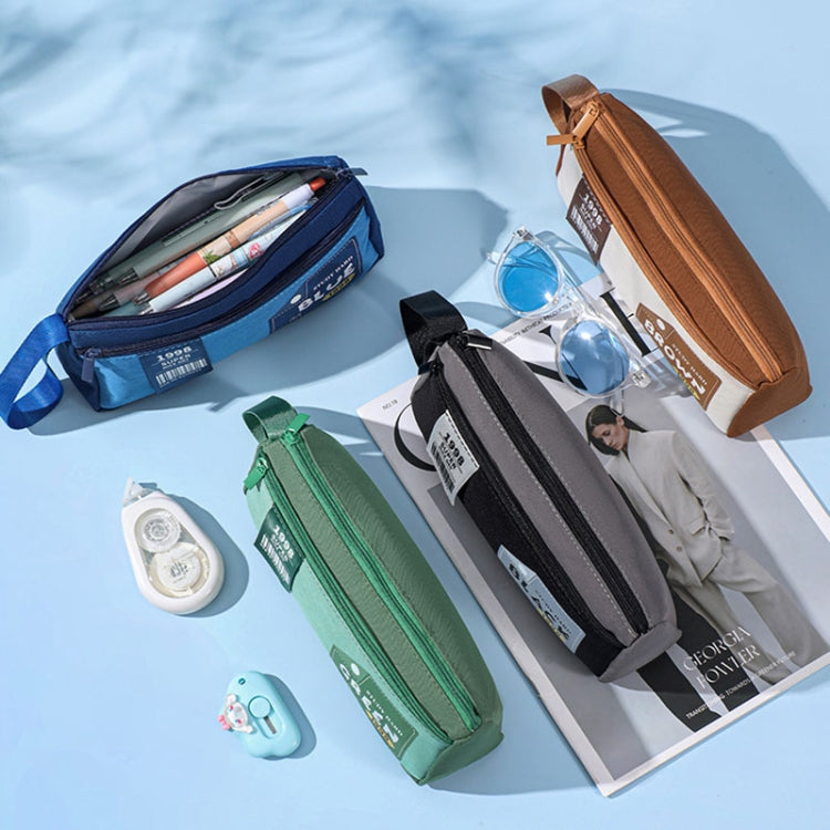 Set of double-layer pencil cases in blue, brown, green, and black colors.