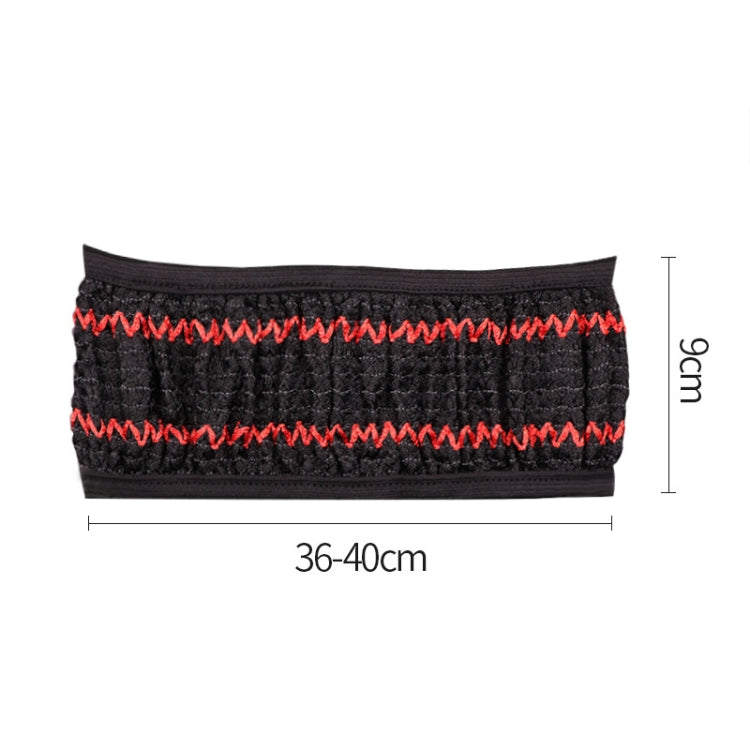 Black steering wheel cover with red zigzag stitching and quilted grip texture