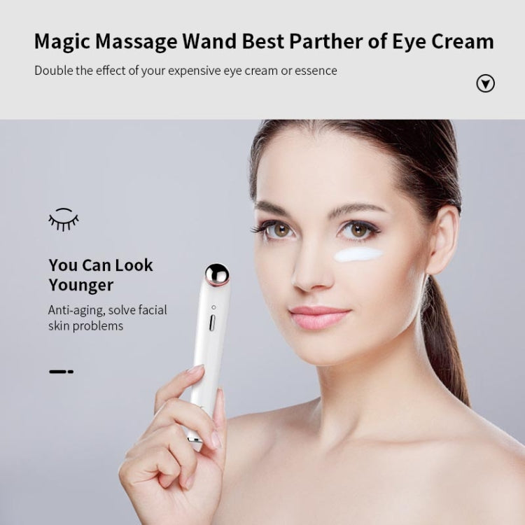White eye massager wand held near eye area with blue light ring