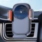 Car wireless phone charger holder mounted on air vent with phone cradle and orange accents.