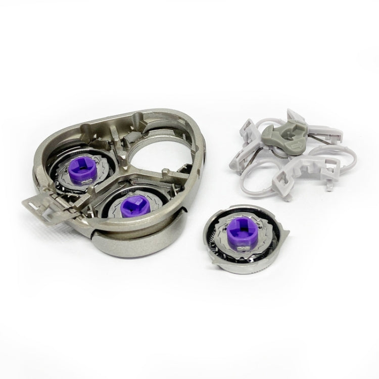Shaver replacement head open view with purple rotor components and blades