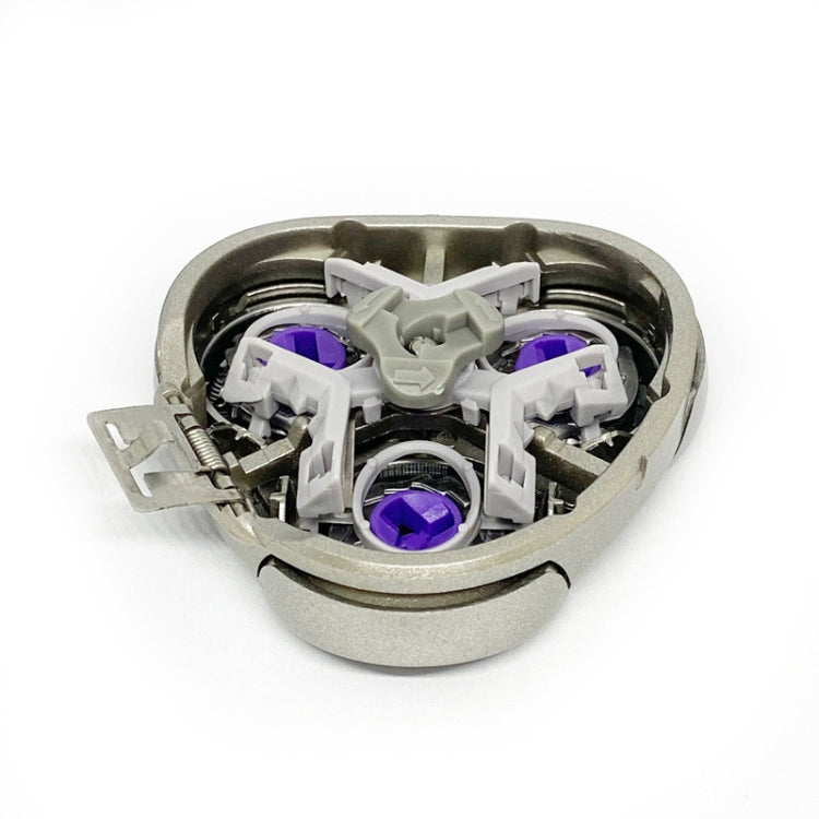 Inside of shaver replacement head showing purple rotors and white plastic parts