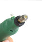 Green mini electric grinder pen with installed bit at the metal chuck tip