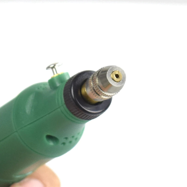 Green mini electric grinder pen with installed bit at the metal chuck tip