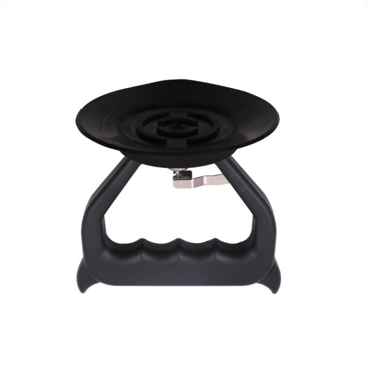 Car dent suction puller viewed from above with black rubber suction cup