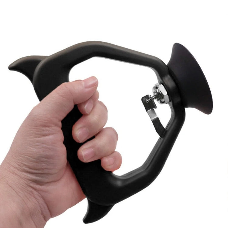 Hand holding black car dent suction puller with chrome connection