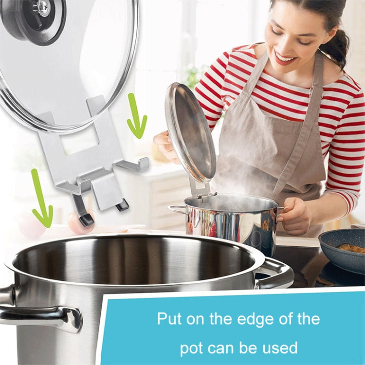 Stainless steel pot lid holder clip placed on the pot rim with silicone pads