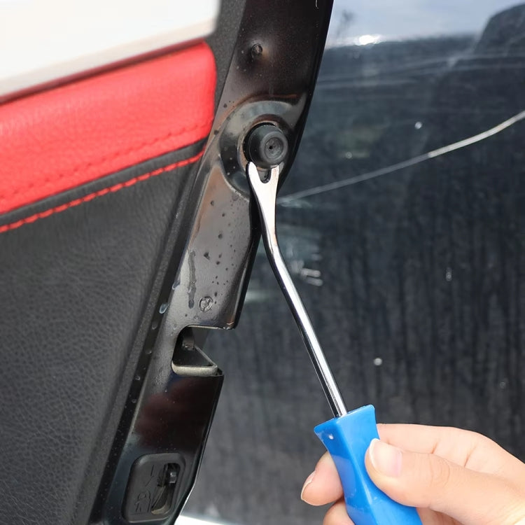 Hand using blue-handled car door panel removal tool to lift trim