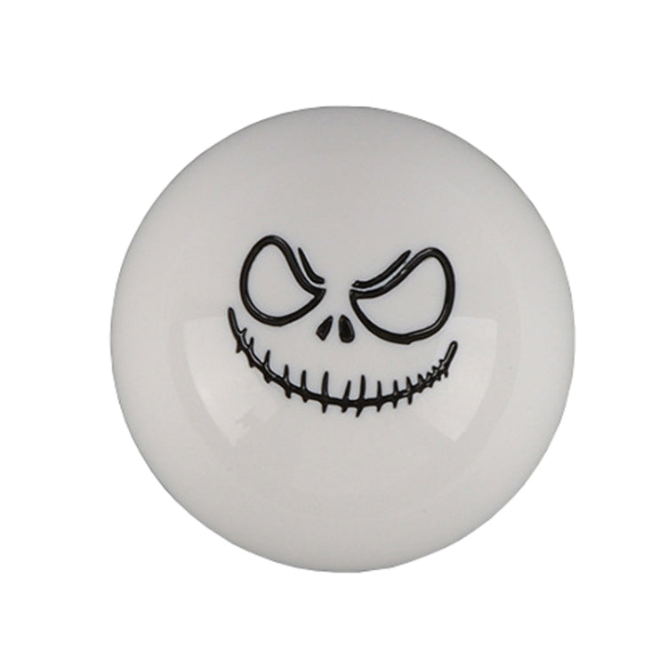 White spherical shift knob with black ghost face and stitched grin