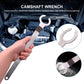 Silver engine tensioner adjustment wrench held by hand with forked open end