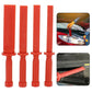 Four red tire scraper pieces with flat tips and open rings at the handle end