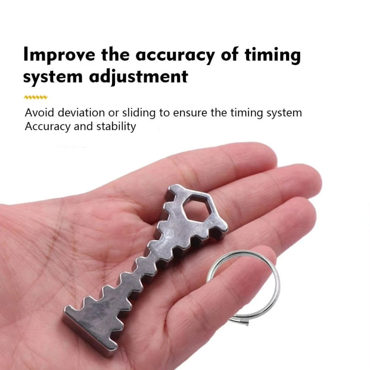 Camshaft timing tool on palm, silver toothed bar with hex opening and hanging ring