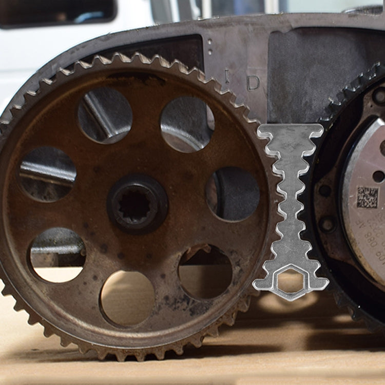 Engine timing gears with metal camshaft holder tool near sprockets