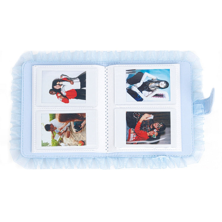 Blue lace photo storage album open with four picture slots and frames