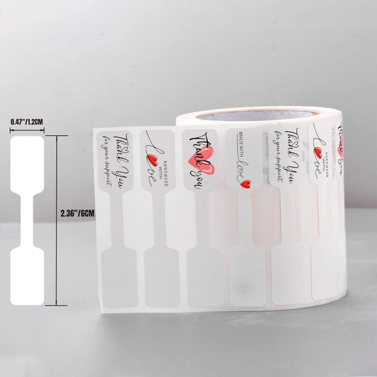 Roll of thank you stickers with red hearts, white label strips