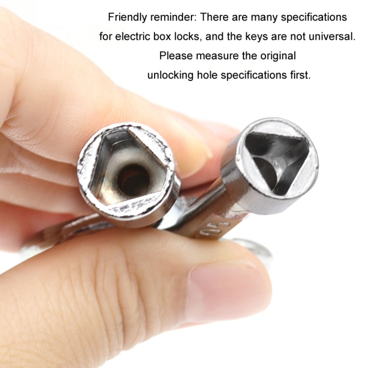 Triangular key wrench close-up with metal socket tip held in a hand