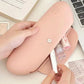 Pink silicone makeup brush storage bag open, showing brushes and beauty items inside