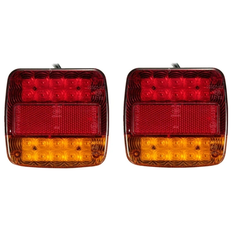 Pair of square trailer LED tail lights with red upper and amber lower lenses on black back