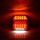Lit square LED trailer brake tail light showing amber and red LED glow