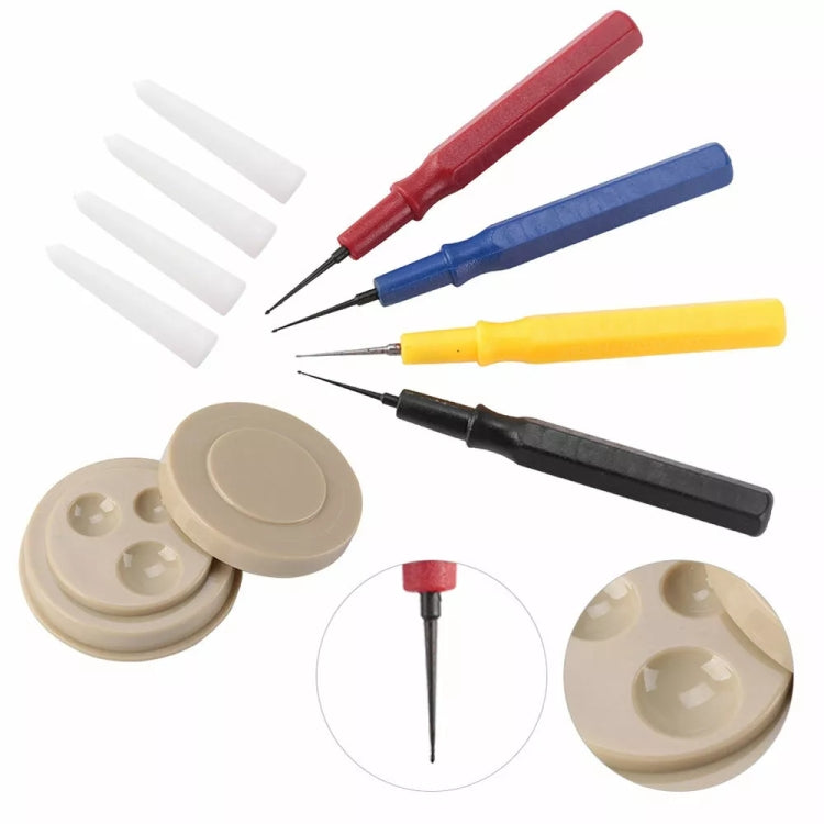 Watch oilers and beige oil dish with four white applicator tips for watch repair