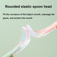 Baby food spoon close-up: translucent flexible spoon head with rounded edge, on pink handle