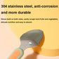 Stainless steel baby food spoon head close-up with textured scraping edge on green handle