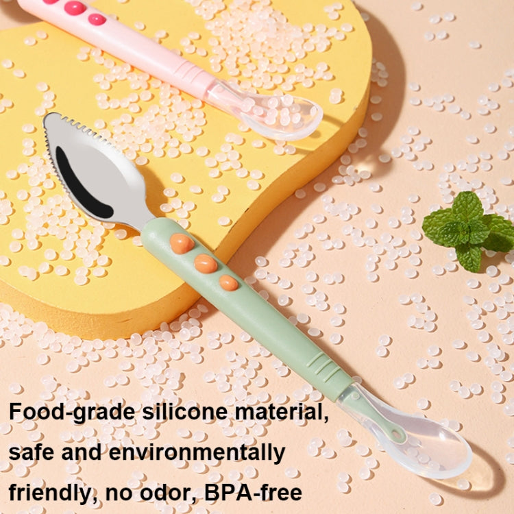 Baby food spoon with translucent silicone head; peach handle with orange dots and mint grip