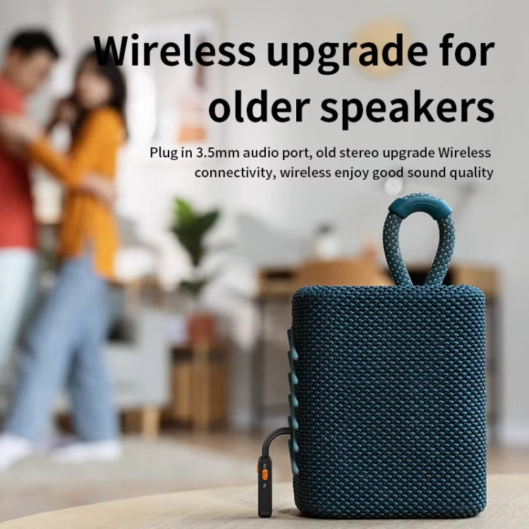 Black Bluetooth receiver/transmitter with 3.5mm audio plug and orange power control