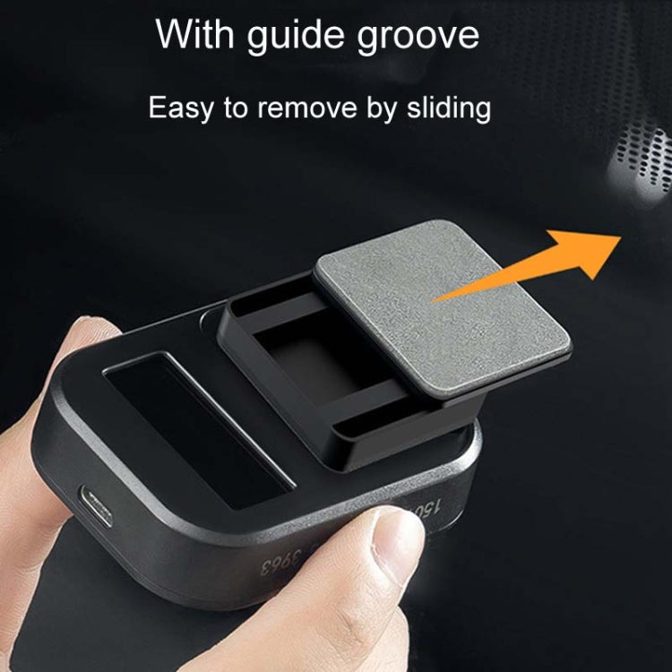 Black ETC bracket with textured base and sliding cover, open for removal