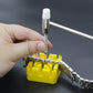 Watch bracelet pin tool removing a pin above a yellow holder
