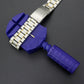 Watch bracelet repair clamp with purple grips and metal links