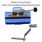 Blue chain sharpener with metal guide arm and crank grinding handle.