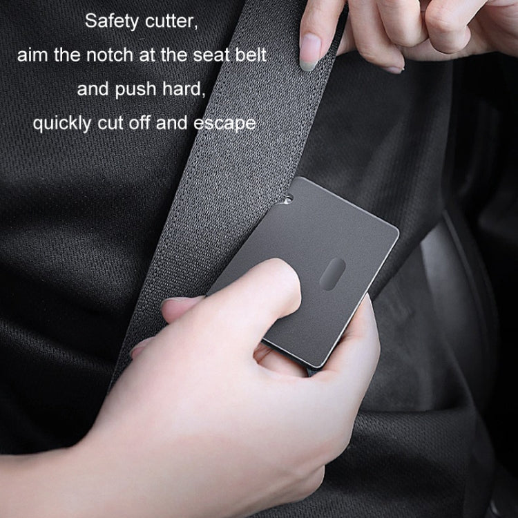 Emergency seat belt cutter safety card with sharp notch on dark metal body