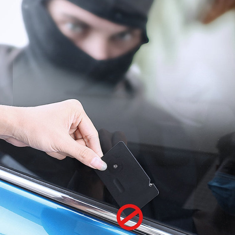 Emergency car window hammer safety card pressed to window frame for impact