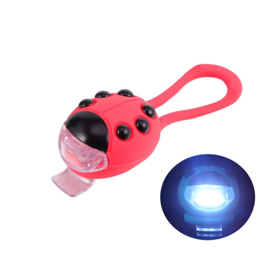Red ladybug LED bicycle headlight with clear front lens and bright white beam