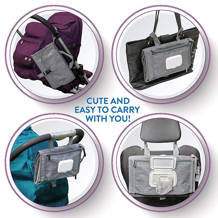 Gray diaper changing pad bag attached to a stroller seat for easy carrying