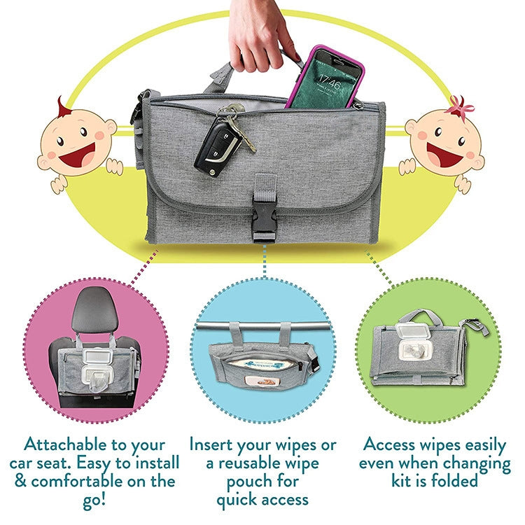Gray waterproof diaper changing pad bag with car-seat attachment and wipes pocket access