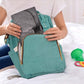 Teal and gray waterproof diaper changing pad bag with front pocket and strap