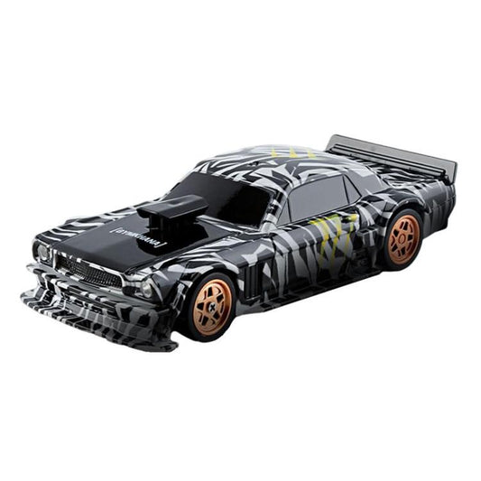 Black camouflage mini drift RC car with rear wing and tan wheels.