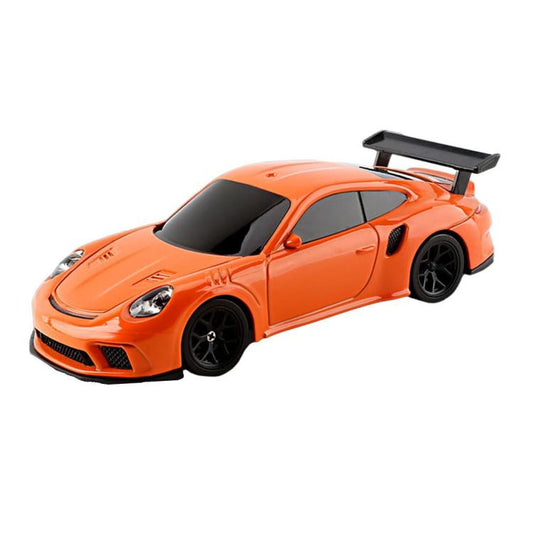 Orange mini drift RC car with rear wing and black wheels.