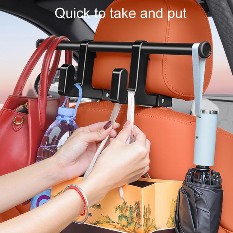 Hands attaching straps to a car seat back hook rack holding small items