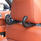 Black rear seat hook installed on orange car seat with two mounting posts
