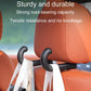 Black car seat hook holding seatbelt straps on orange upholstery