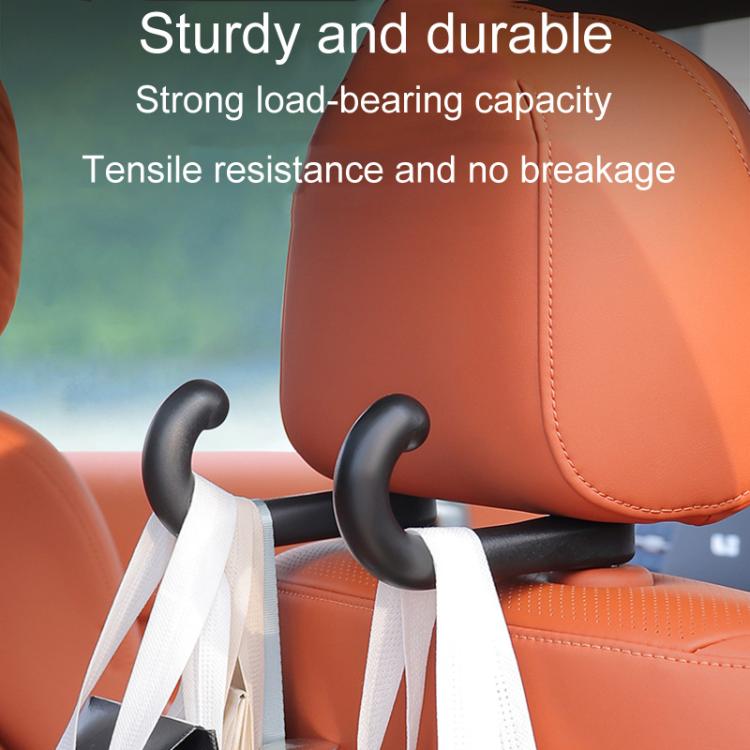 Black car seat hook holding seatbelt straps on orange upholstery
