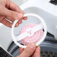 White hair lint catcher case open with pink studded ball inside, showing closing clip
